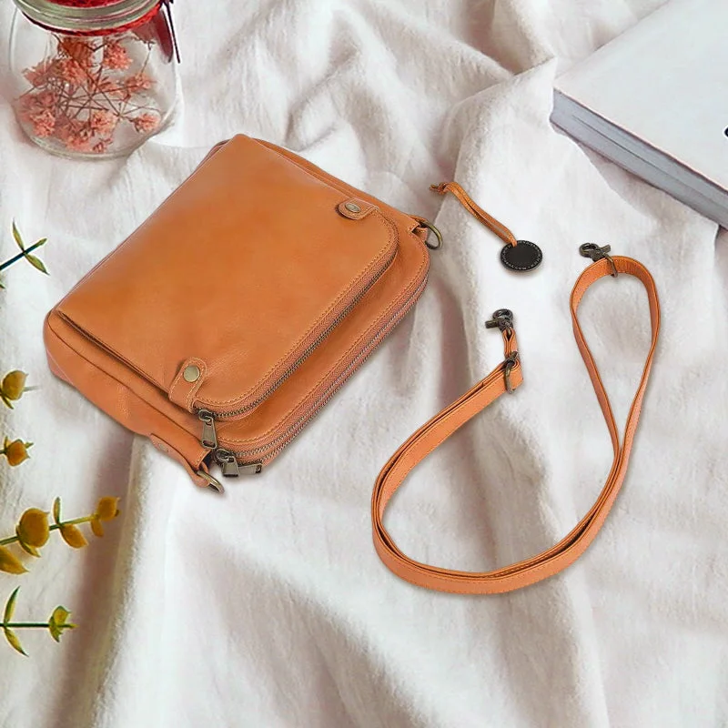 Belro three-layer leather crossbody bag and clutch, featuring multiple compartments, in a stylish design with adjustable strap.