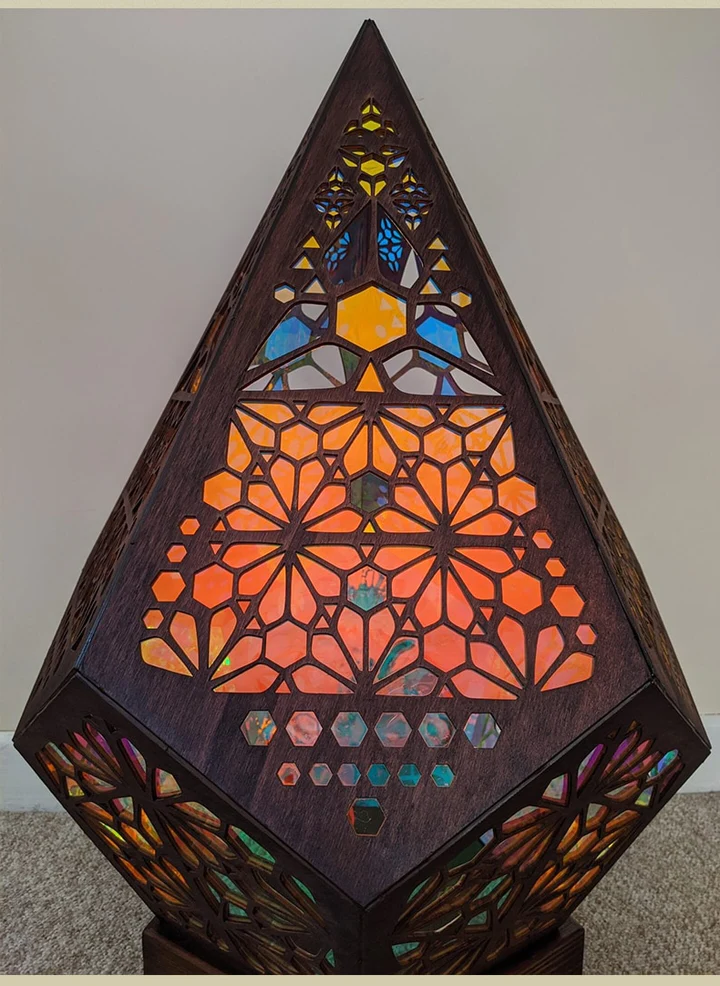 Colorful bohemian projection night light by Belro, illuminating with vibrant patterns for cozy evening ambiance.
