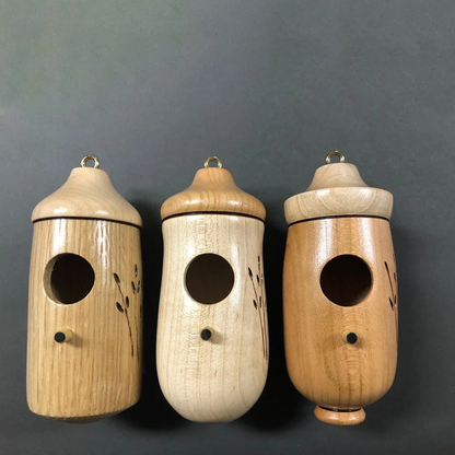 Wooden hummingbird house by Belro, decorative garden decor for nature lovers, showcasing a handcrafted wooden bird shelter.