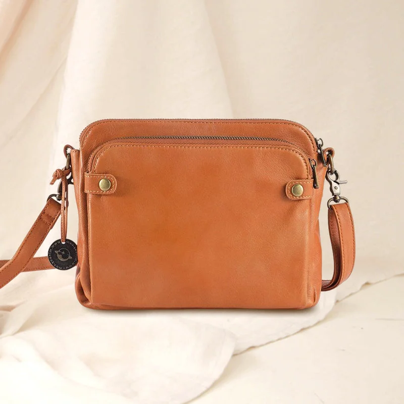 Belro three-layer leather crossbody bag and clutch with adjustable strap, featuring multiple compartments and a sleek design.