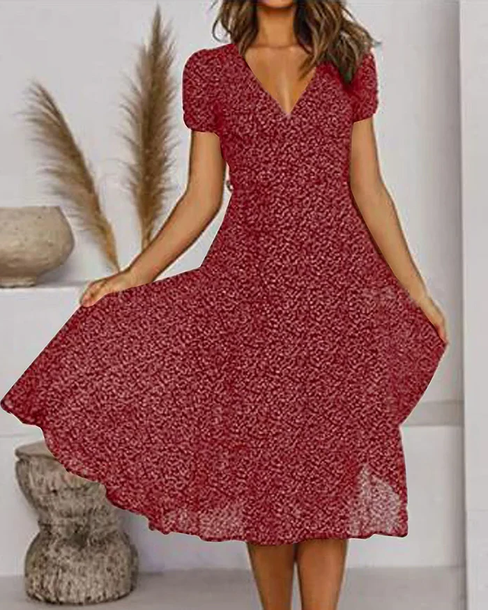 Floral print Belro chiffon V-neck dress with long sleeves and flowing fabric, perfect for spring or summer occasions.