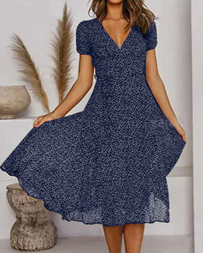 Floral print Belro chiffon V-neck dress with long sleeves and flowing fabric, perfect for casual or semi-formal occasions.