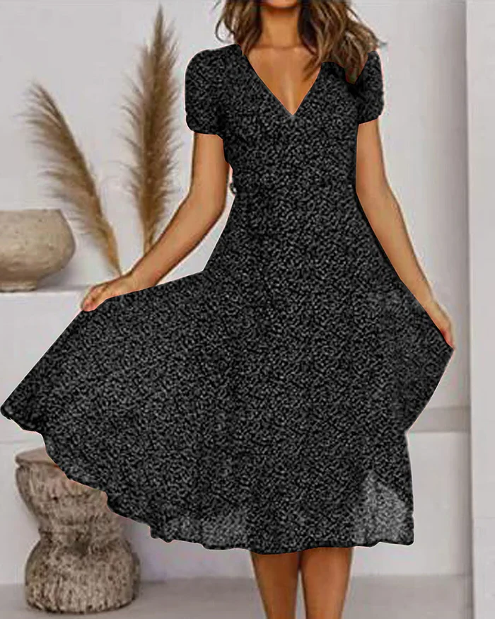 Floral print V-neck chiffon dress by Belro, showcasing lightweight fabric and vibrant blossom pattern, perfect for spring and summer wear.