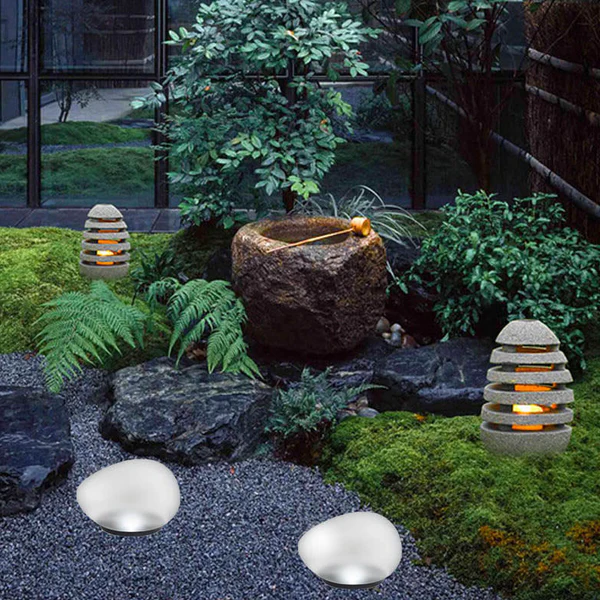 Belro Solar Pebble LED outdoor landscape light with sandblasted glass, ideal for garden or pathway illumination.