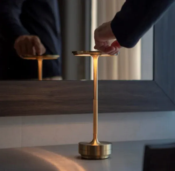 Belro wireless table lamp illuminated on a desk, modern design perfect for night lighting and ambient decor.