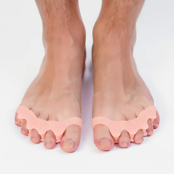 Belro orthopedic hammer toe splint positioned on a person's toe, designed to realign and support toe correction in health and beauty.