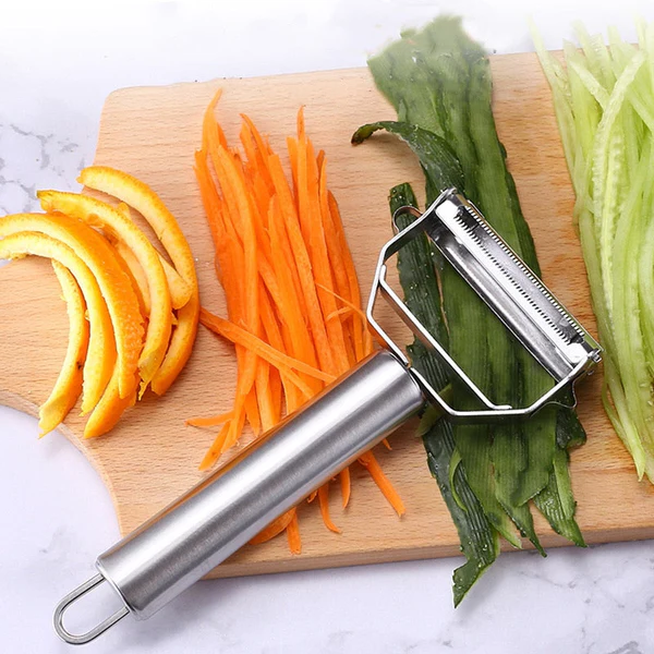 Belro dual-blade peeler for slicing, with stainless steel blades, displayed on a white kitchen surface.