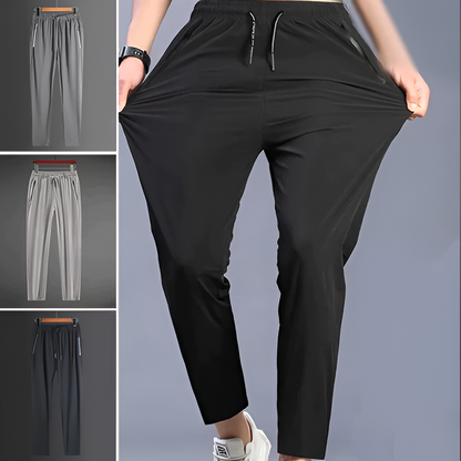 Men's Belro stretch quick-dry hiking pants in dark gray, showing the lightweight, flexible fabric and elastic waistband.