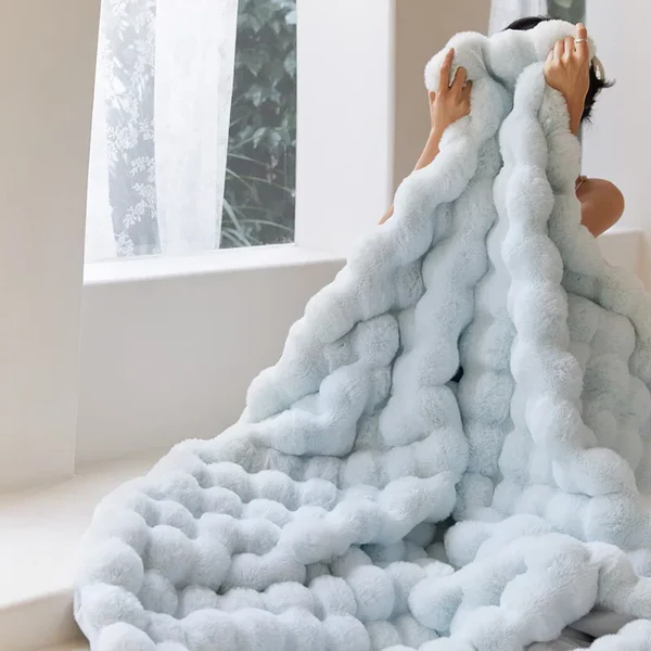Belro Winter Warm Rabbit Faux Fur Throw Blanket draped over a cozy armchair, showcasing soft, plush texture for home decor.