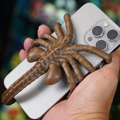 Belro Horrible Facehugger phone holder mounted on a phone, showcasing a unique and creepy alien-inspired design.