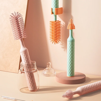 Electric baby bottle brush by Belro, shown with bristles and handle for cleaning baby bottles, not related to footwear or pumps.