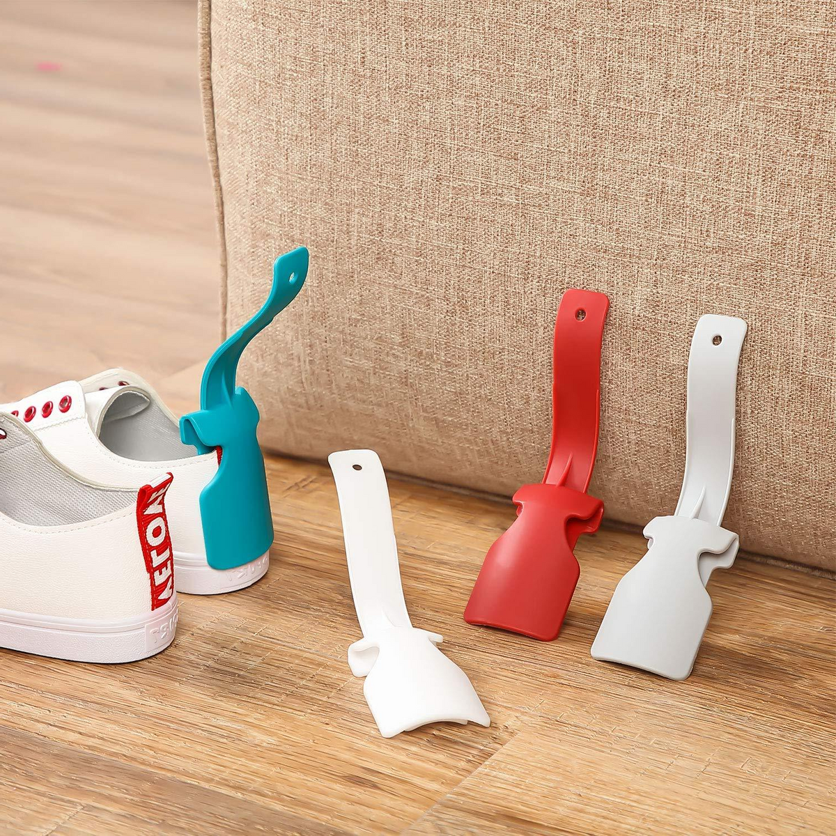 Belro Clip-N-Slip easy lazy shoe horn, sleek design for slipping on shoes effortlessly, shown with a dress in the image.