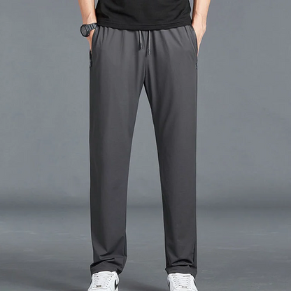 Men's Belro stretch quick dry hiking pants, activewear clothing, showing the lightweight fabric and relaxed fit for outdoor hiking.