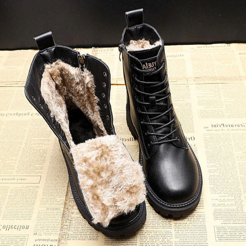 Black Belro leather winter boots with a sturdy design, featuring a smooth finish and thick soles for cold weather wear.
