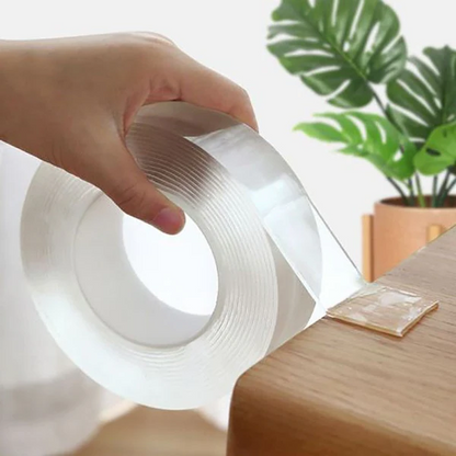 Clear double-sided nano tape by Belro for office and home, showing its thin, transparent, reusable, traceless adhesive on a surface.