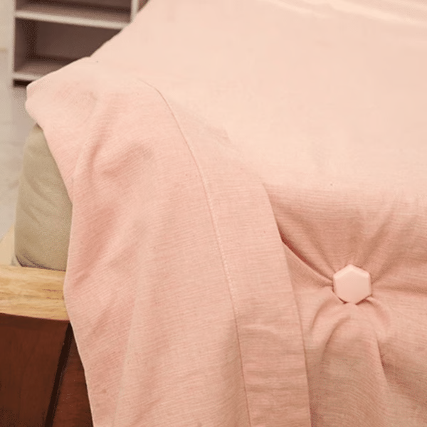 Set of Belro bed sheet grippers clips attached to a fitted sheet to keep bedding secure and in place.