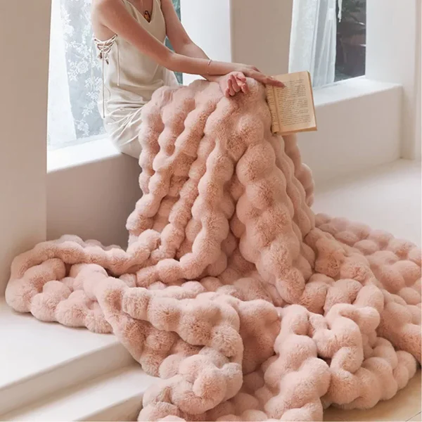 Belro winter warm rabbit faux fur throw blanket draped over a sofa, soft and plush for cozy home decor.