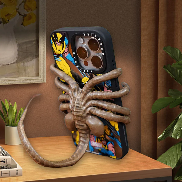 Belro Horrible Facehugger phone holder mounted on a smartphone, showcasing its unique design and secure grip for electronics accessories.