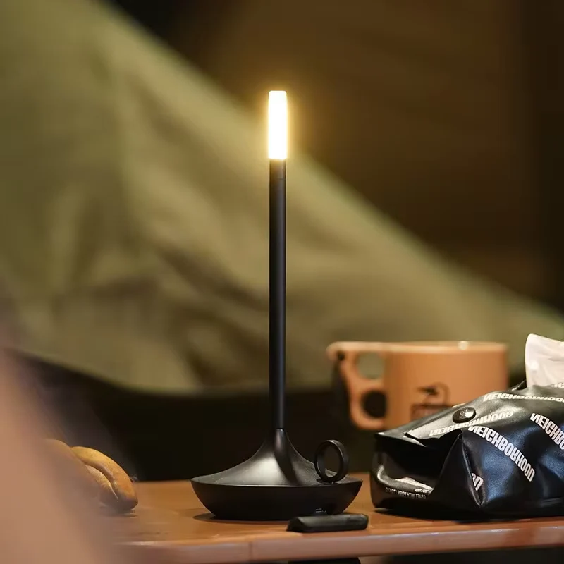 Belro rechargeable touch table lamp with sleek modern design, illuminated with a soft, adjustable glow for night lighting.