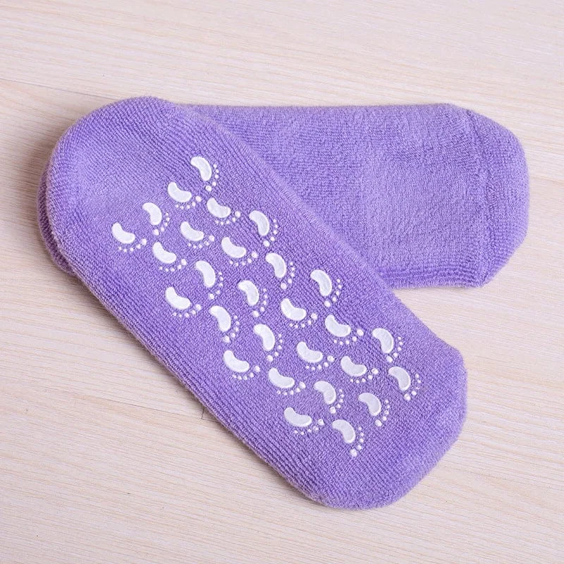 Belro moisturizing socks with spa gel lining for nourishing foot care, shown in a cozy setting with the socks partially on feet.