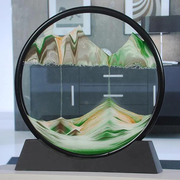 Colorful deep sand art display in a glass container, creating intricate layered patterns for home decor by Belro.