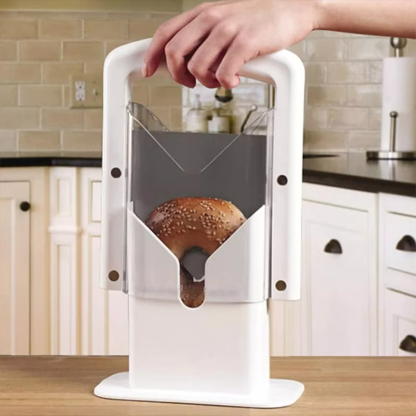Belro stainless steel bagel slicer for small and large bagels, with sharp blade and ergonomic handle, placed on a kitchen countertop.