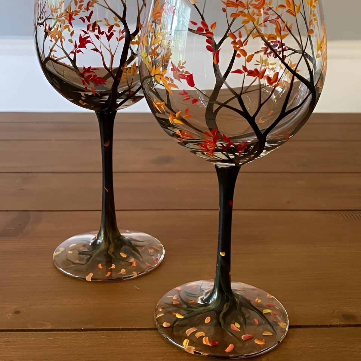 Hand-painted Four Seasons Tree wine glasses by Belro, elegant glassware accessory showcasing detailed seasonal artwork.