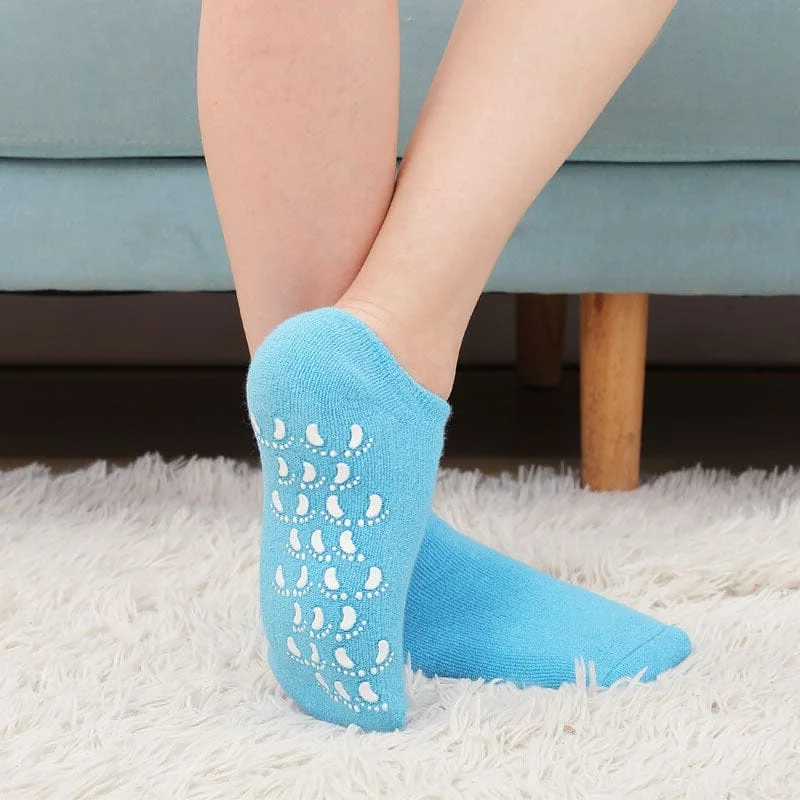 Belro moisturizing socks with spa gel lining for softening skin, shown on feet in a cozy home setting.