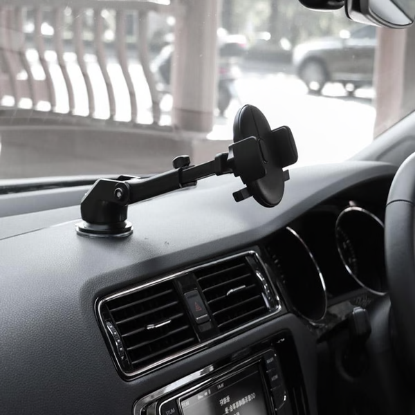 Belro car phone retractable mount holder attached to a car dashboard, holding a smartphone securely for hands-free driving.