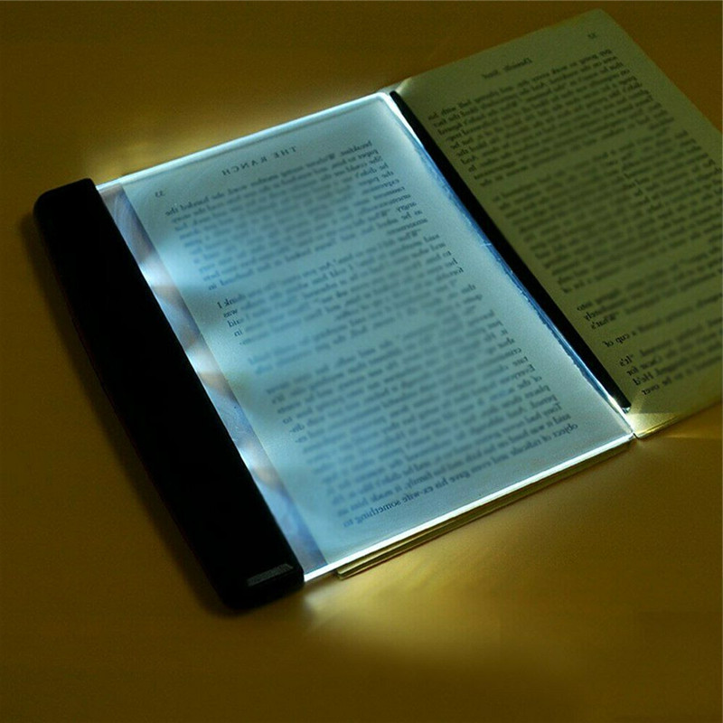 Belro Bright Eyes Book LED light clipped onto a book, providing focused illumination for reading and office use.
