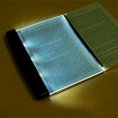 Belro Bright Eyes Book LED light clipped onto a book, providing focused illumination for reading and office use.