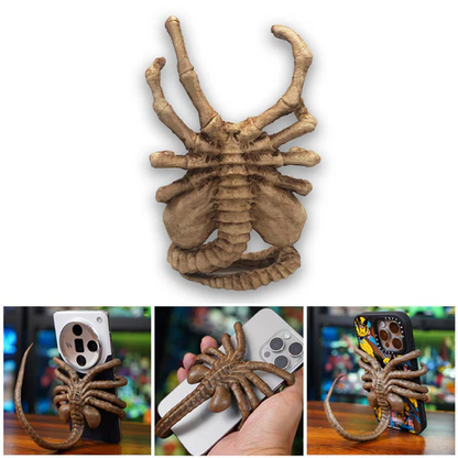 Belro Facehugger phone holder attached to a smartphone, featuring a creepy alien facehugger design for electronics and phone accessories.