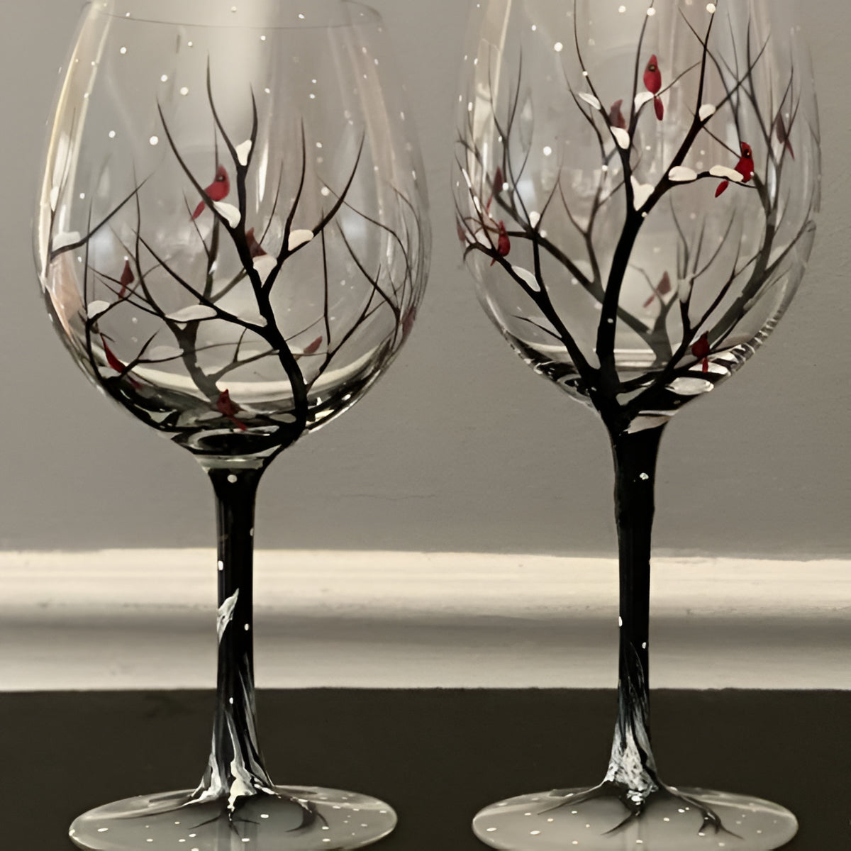 Hand painted Four Seasons Tree wine glasses by Belro, elegant glassware accessory with detailed nature-inspired artwork.