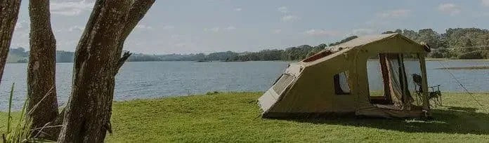 Casavibeo OZTENT RX5 family camping tent set up outdoors with multiple windows and a spacious interior for outdoor adventures.