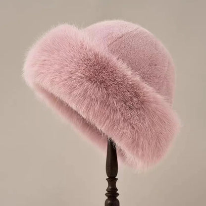 Pink women's plush winter bucket hat by Belro, cozy accessory with soft, warm fabric perfect for cold weather.