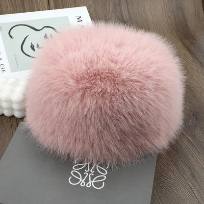 Pink Belro luxury faux fur winter hat with plush texture and cozy design, perfect for cold weather accessories.