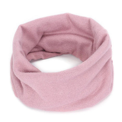 Pink Belro cashmere winter scarf and neck warmer, soft and cozy accessory for cold weather, styled as shown in the image.