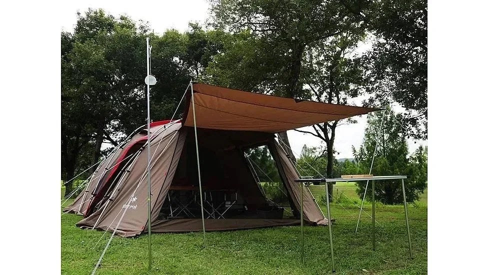 Snow Peak Land Lock Shelter tent set up outdoors with rainfly and stakes, showcasing durable camping gear by Casavibeo.
