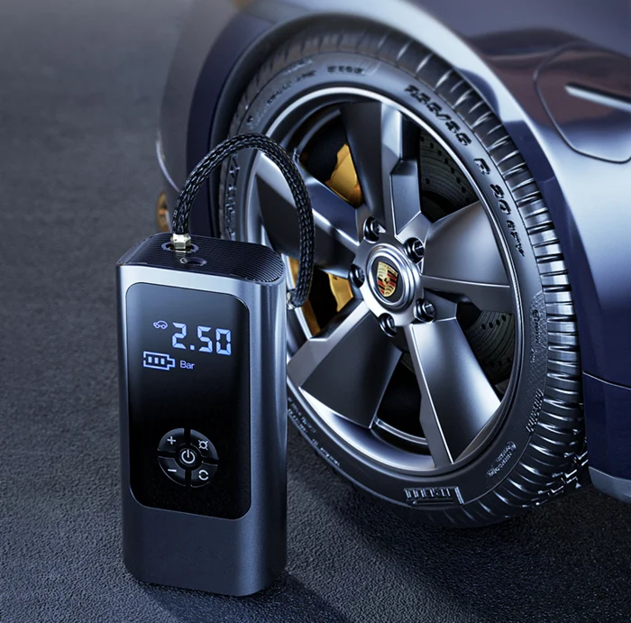 Portable 12V tire inflator compressor by Mivoza Deutschland with dual power for car and bicycle tires.