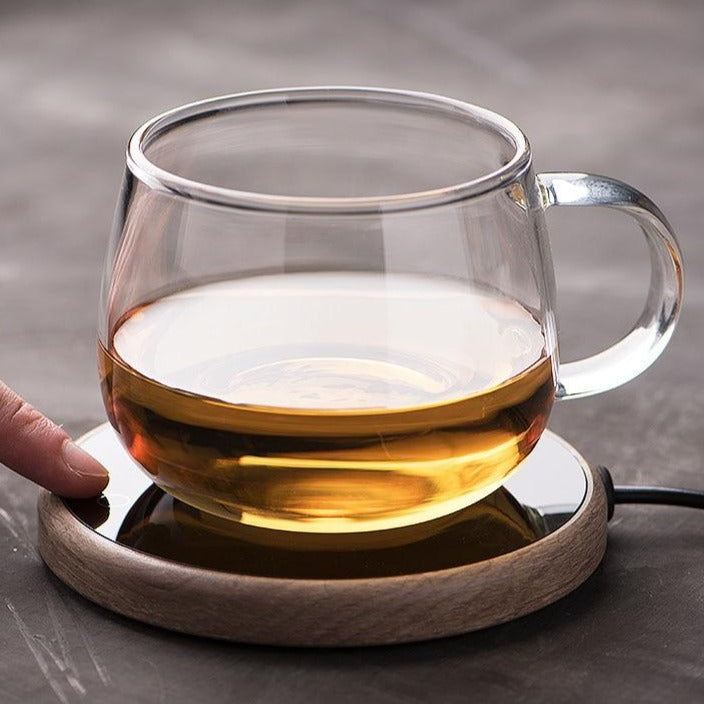BowLift ceramic mug warmer coaster with smart electric temperature control, sleek design for maintaining beverage warmth.