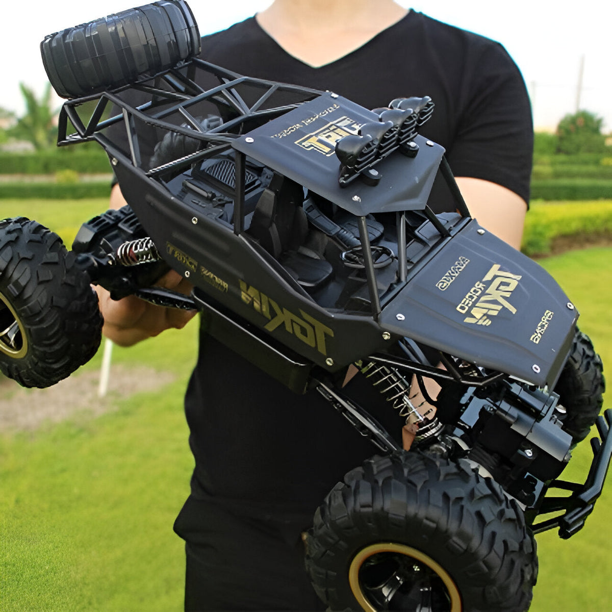 Belro 4x4 Rock Crawler Monster Truck in black with large tires and rugged suspension on rocky terrain.