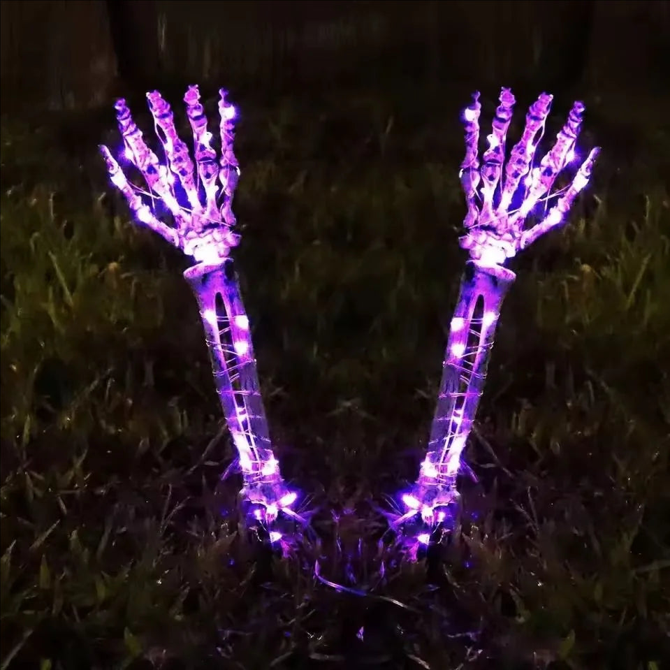 Purple Halloween skeleton hand solar light attached to umbrella, decorative accessory by Belro for spooky outdoor Halloween decor.