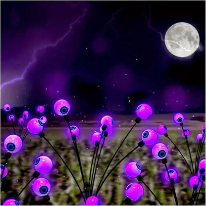 Purple Halloween eyeball garden light prop from Belro, solar-powered, perfect as a spooky umbrella accessory for Halloween decor.