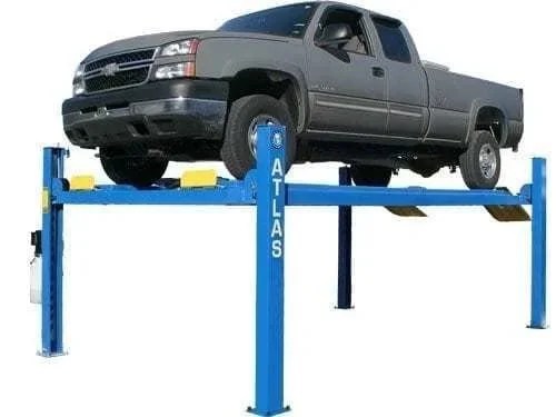 Casavibeo Atlas 412 12,000 lbs commercial 4-post lift with sturdy steel posts and hydraulic system for vehicle maintenance.
