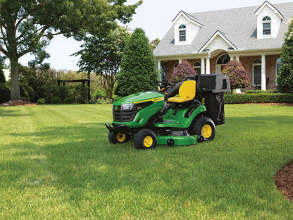 John Deere S140 48-inch riding lawn tractor with 22 HP V-twin gas engine and hydrostatic transmission, shown on a lush green lawn