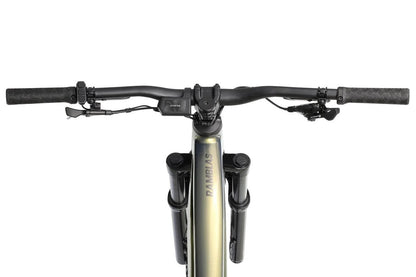 Aventon Ramblas eMTB bicycle with a sleek black frame and mountain bike design, displayed outdoors in a scenic setting.