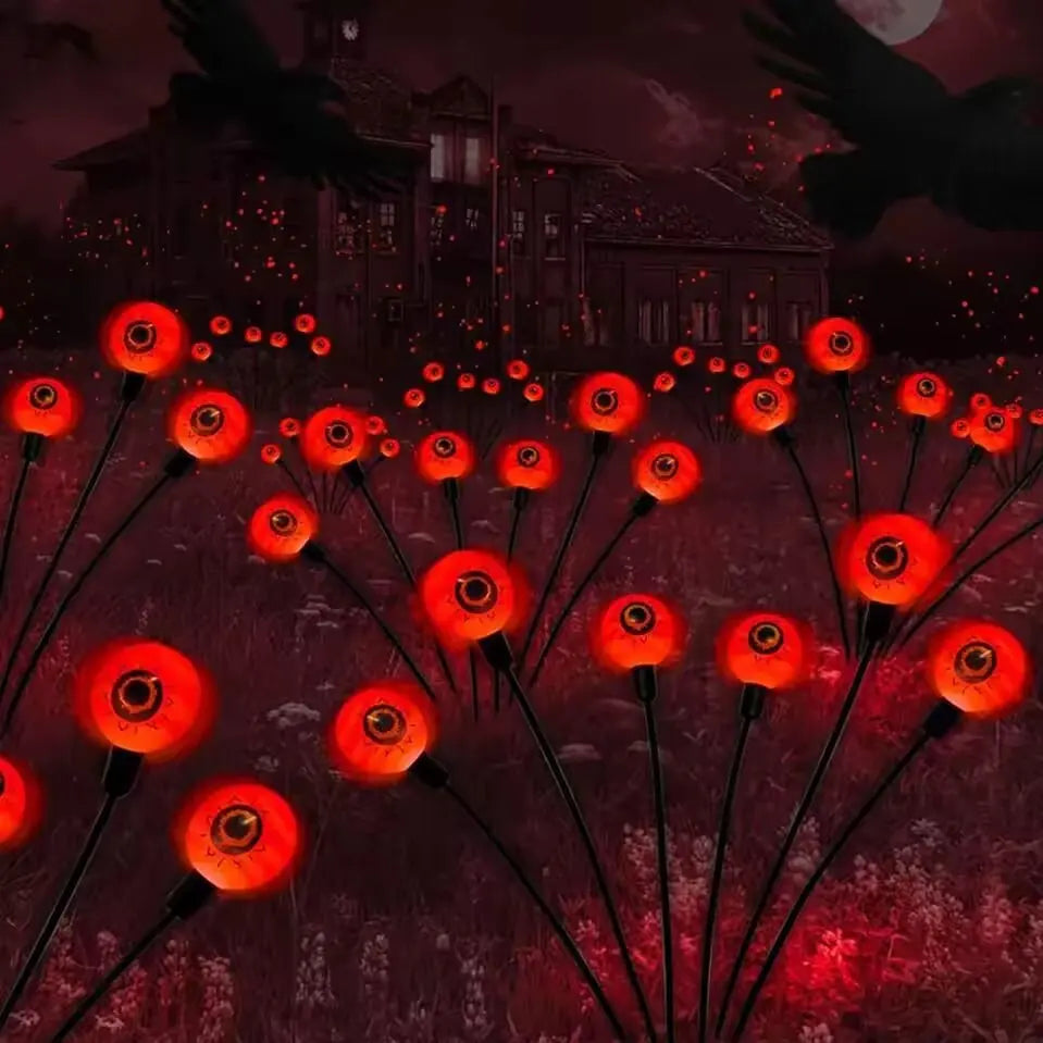 Red solar-powered Halloween eyeball garden light accessory with illuminated eyeball design, perfect for spooky outdoor decor.