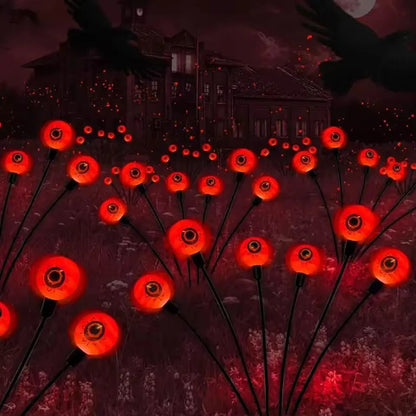 Red solar-powered Halloween eyeball garden light accessory with illuminated eyeball design, perfect for spooky outdoor decor.