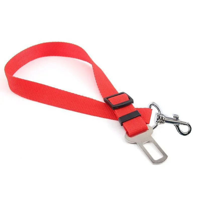 Red Belro adjustable dog seat belt attached to car seat for secure pet travel safety.