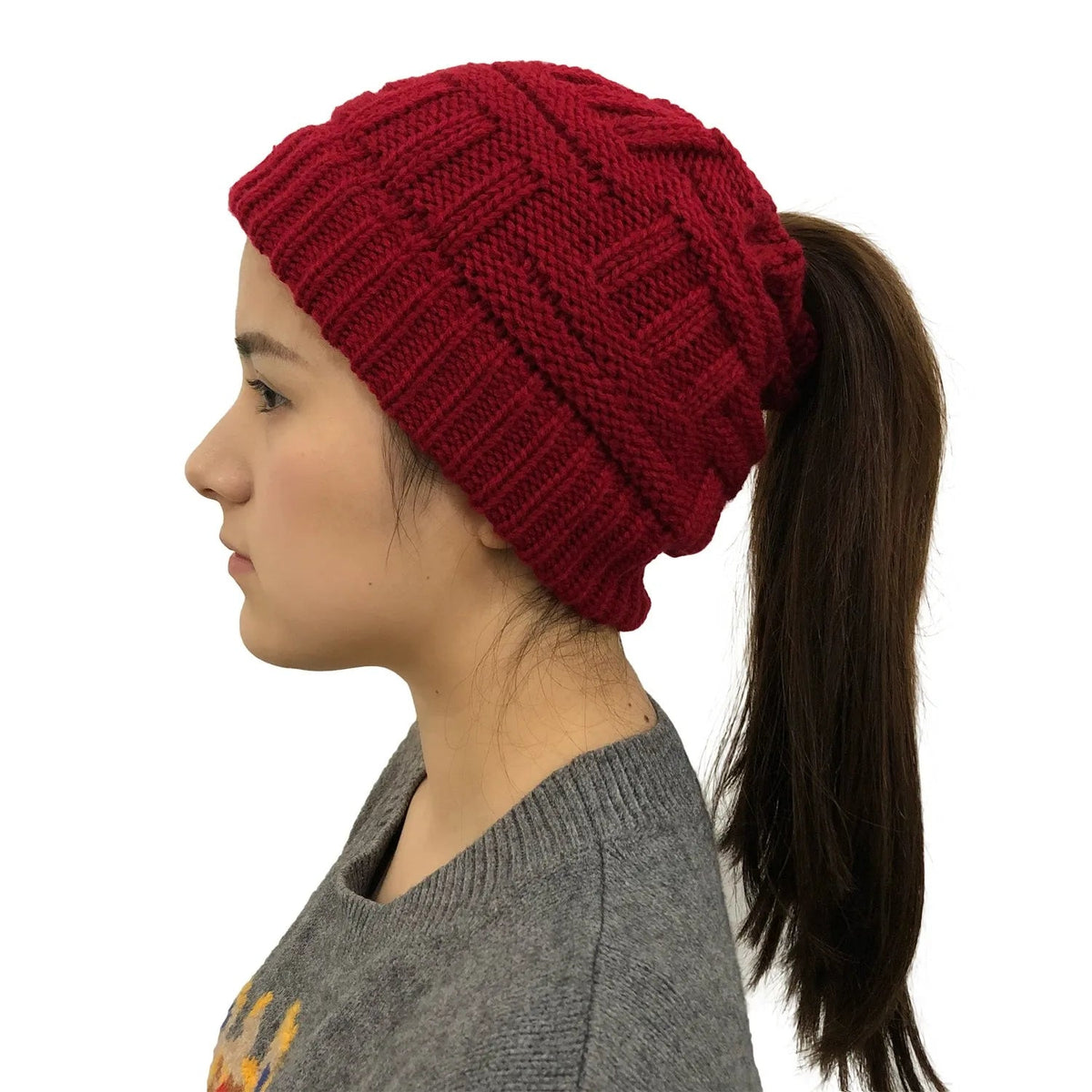 Red Belro women’s winter knit beanie with a built-in ponytail opening, cozy and stylish for cold weather.